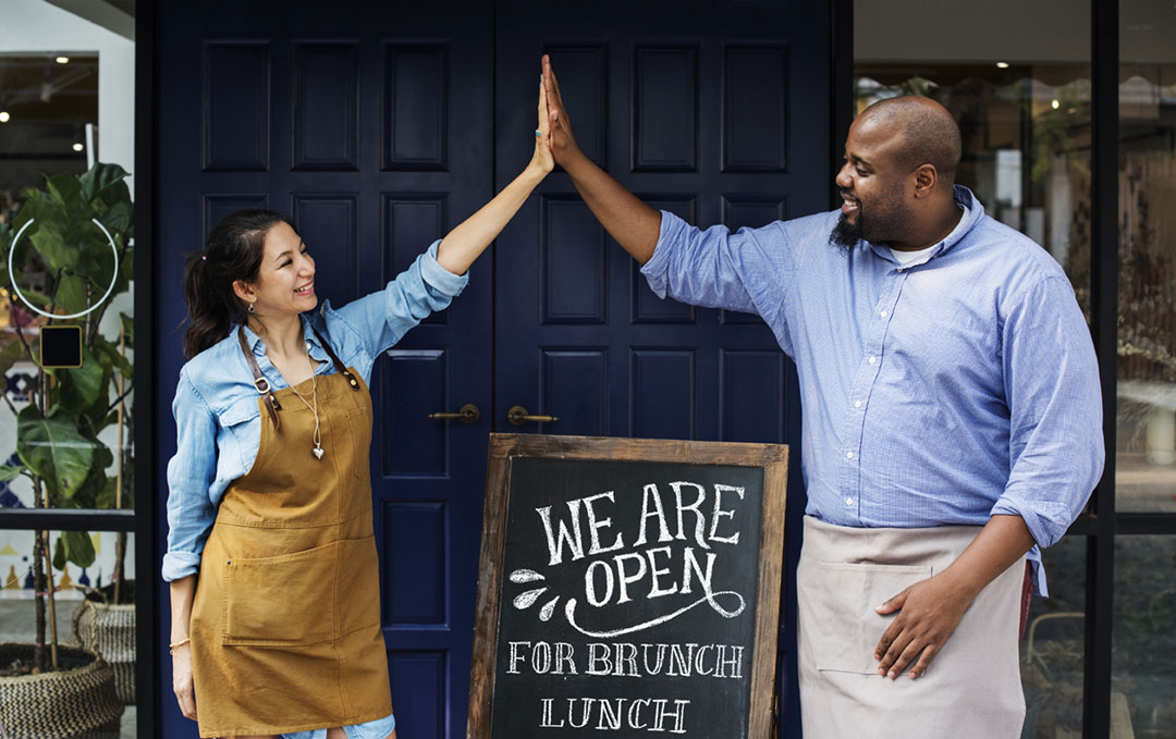 business owners doing a high five